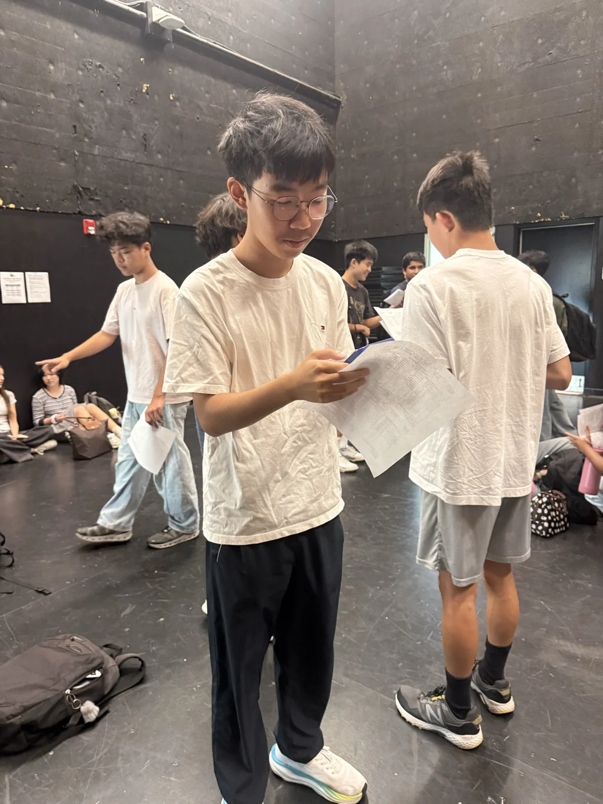 Standing with friends in a busy room