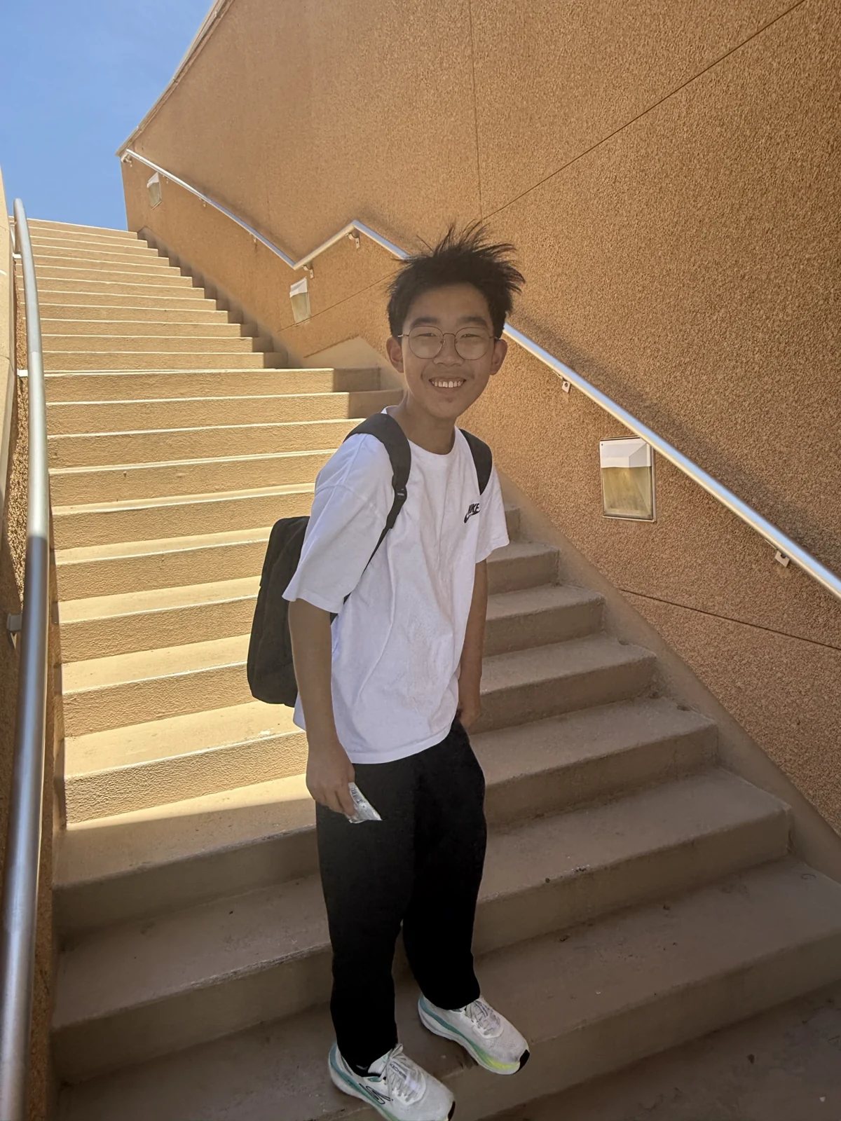 Standing on a staircase in the sunshine