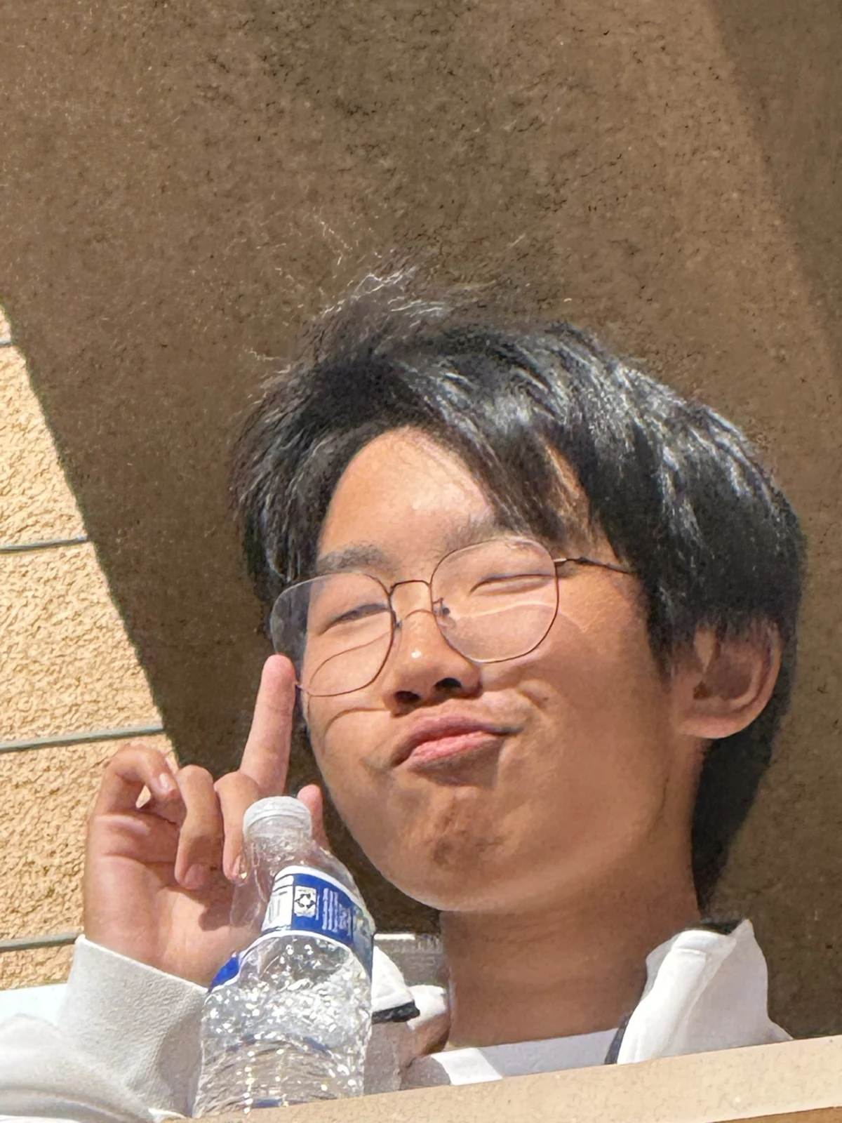 Making a peace sign in the sunshine